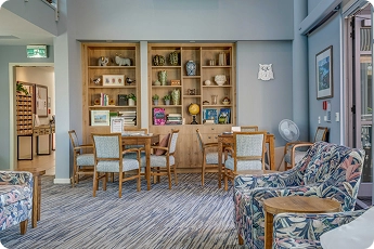 Refurbished communal lounge and library at Lady Allum Retirement Village